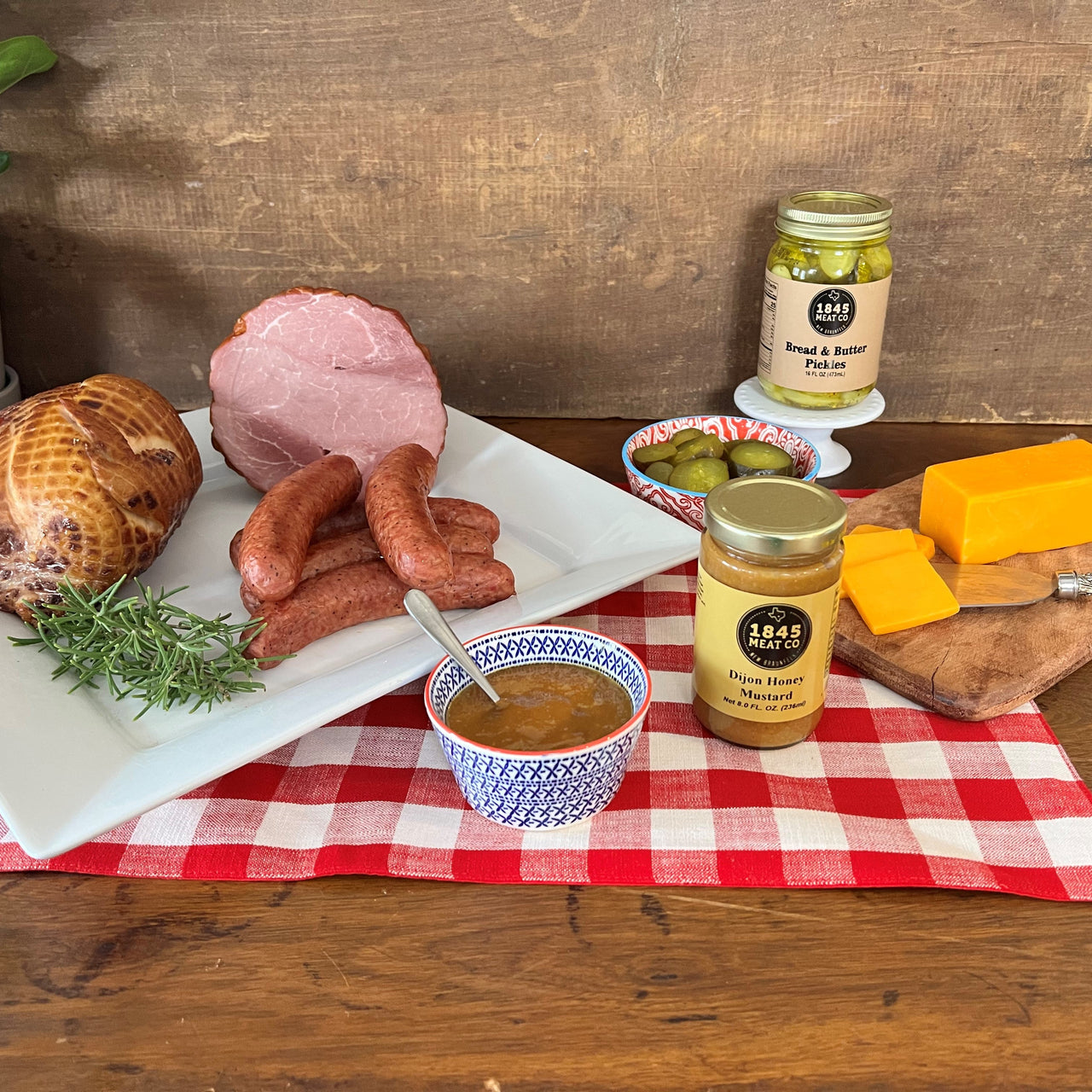 Some of our best.  Includes:  1 lb. of Pork & Beef Sausage 8 oz. Smoked Cheddar Cheese 2 1/2 lb. Smoked Chicken 2 - 3 lb. Smoked Boneless Ham 16 oz. Jar of Bread & Butter Pickles 8 oz. Jar of Honey Dijon Mustard Item #45