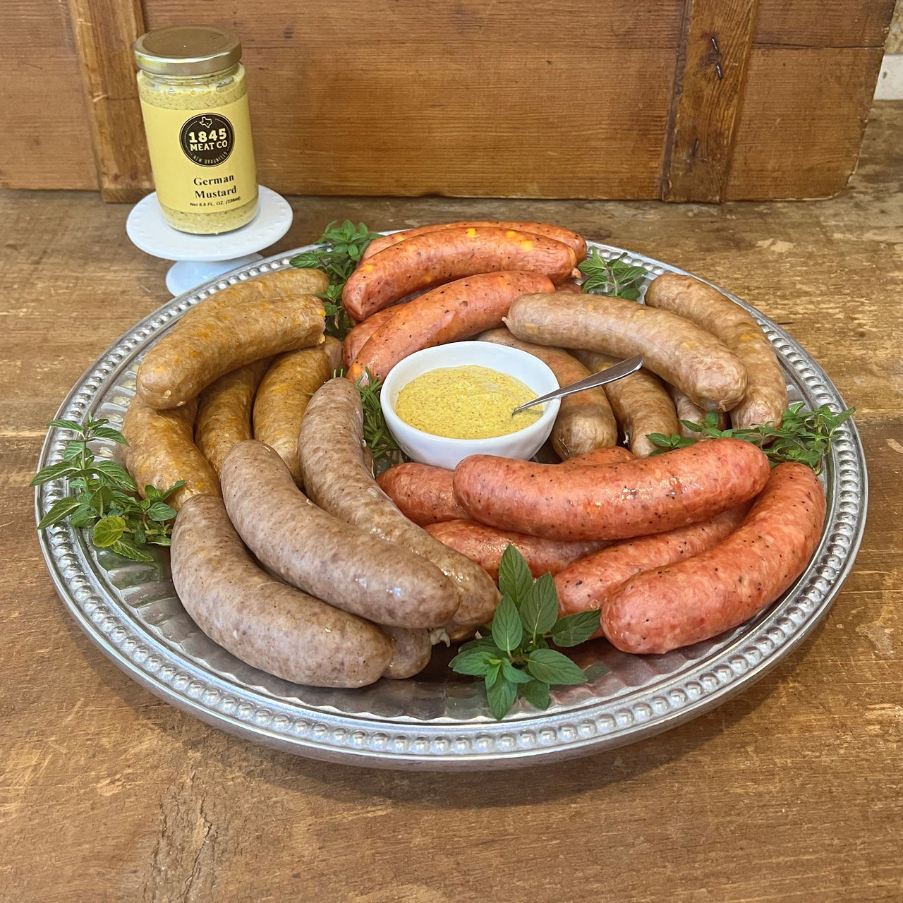 This great collection of some of our best sausage is a family favorite.  Includes:  16 oz. Pork & Beef Sausage 16 oz. Bratwurst 16 oz. Cheddar Sausage 16 oz. Peach Jalapeno Sausage 16 oz. Spiced Apple Sausage 8 oz. Jar of German Mustard ﻿Item #50E