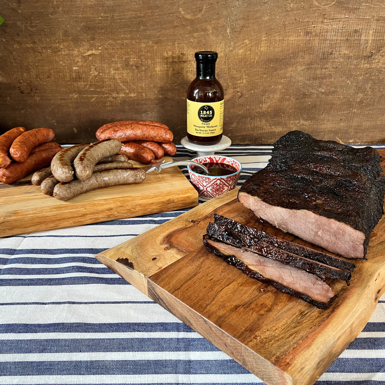 An assortment of items that will make your next gathering or picnic a success.  Includes:  4 - 6 lbs. Smoked Beef Brisket 16 oz. Smoked Pork & Beef Sausage 16 oz. Bratwurst 16 oz. Smoked Cheddar Sausage 13.5 oz. Jar of Sweet Molasses BBQ Sauce ﻿Item #80E