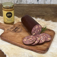 Thumbnail for Just the right amount of spice with a little bit of jalapeno added to our pork and beef summer sausage. The best snack for watching the game or entertaining a small crowd.  ﻿Item #755E  12 oz. Chub