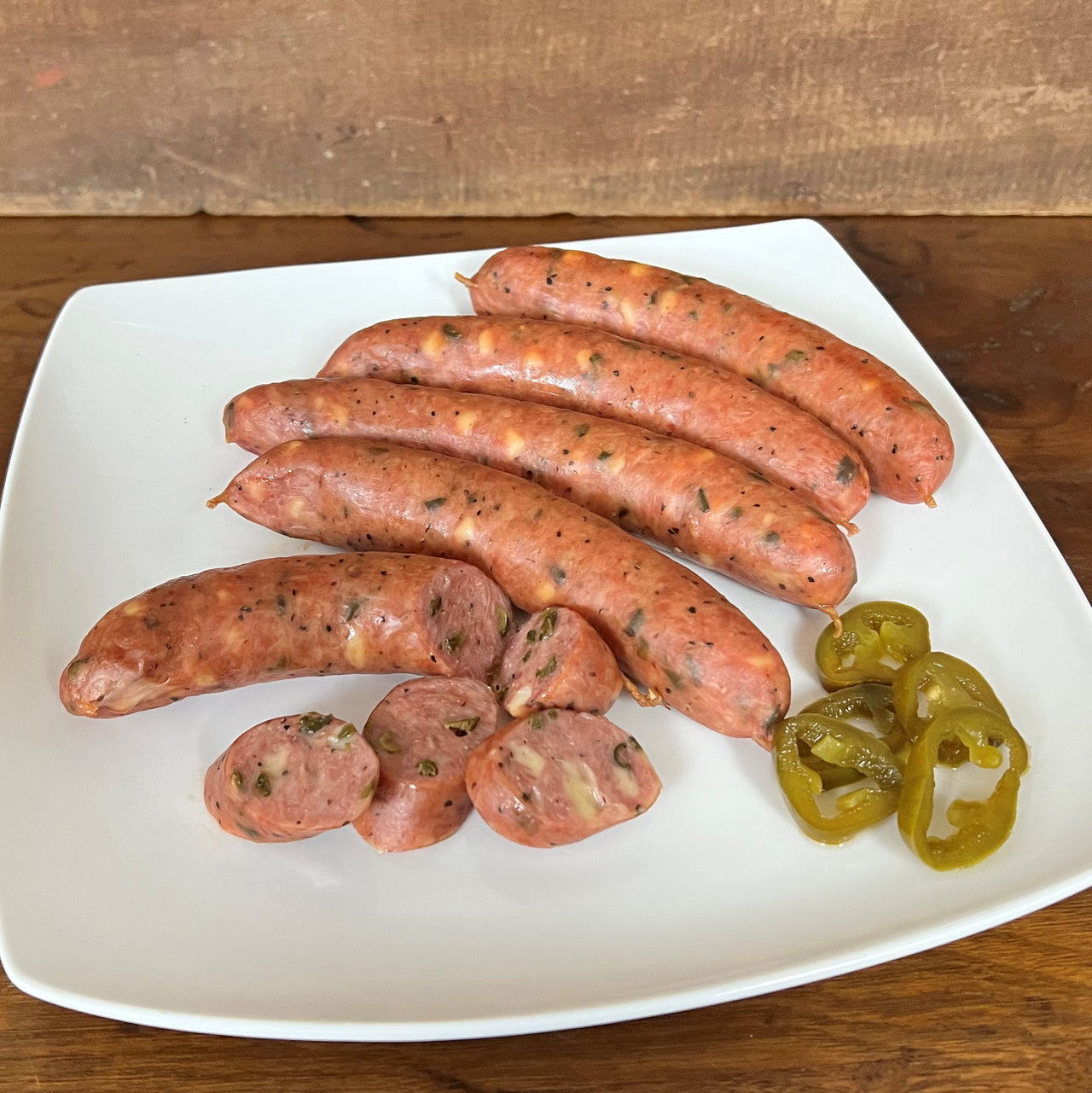 Our Award-Winning Gouda Jalapeno Sausage is a favorite of all who taste it.  Just the right amount of Gouda Cheese and the spice of dried jalapenos make this sausage a great taste by itself or with any side of your choice.  Item #713E  16 oz. Package