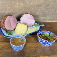 Thumbnail for A great assortment of our Boneless Hams that will make your mouth water.  Includes:  2 - 3 lbs. Boneless Ham 2 - 3 lbs. Peppered Boneless Ham 8 oz. Smoked Baby Swiss Cheese 8 oz. Jar of Honey Dijon Mustard 16 oz. Jar of Sweet Fire Pickles ﻿Item #55E