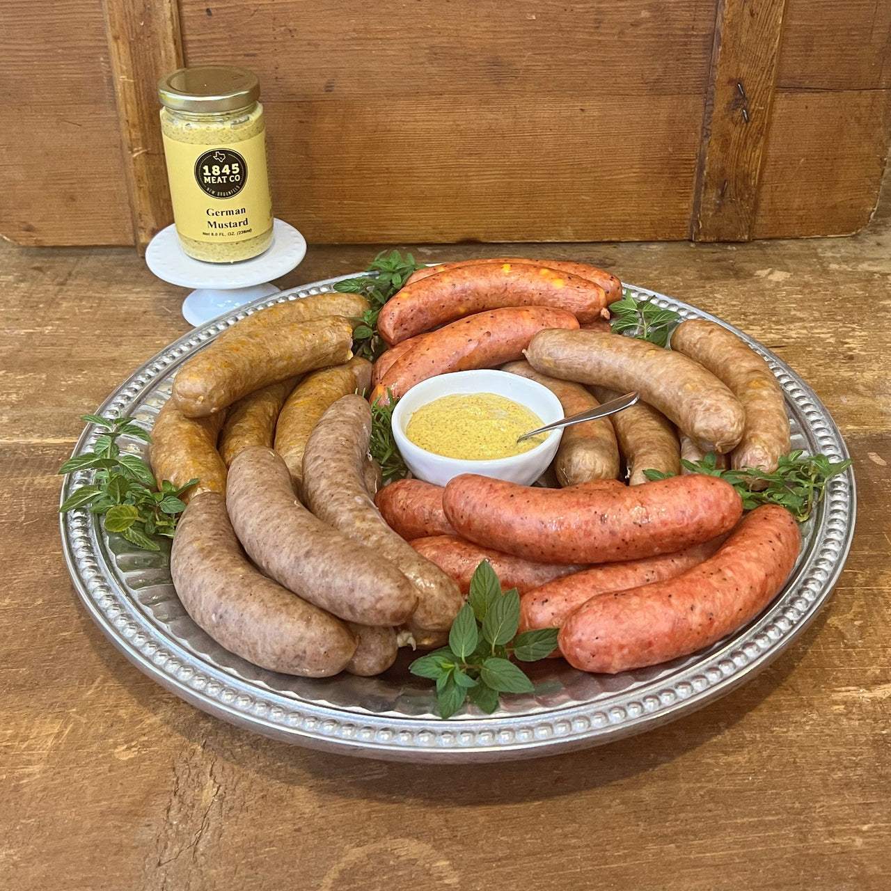 This great collection of some of our best sausage is a family favorite.  Includes:  16 oz. Pork & Beef Sausage 16 oz. Bratwurst 16 oz. Cheddar Sausage 16 oz. Peach Jalapeno Sausage 16 oz. Spiced Apple Sausage 8 oz. Jar of German Mustard ﻿Item #50E